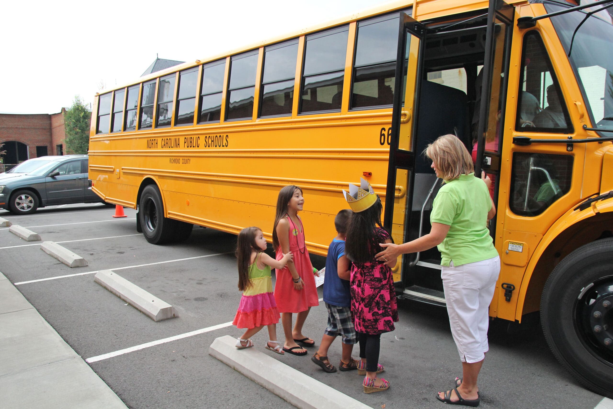 Children learning to load onto a bus during the annual Countdown to Kindergarten event at Discovery Place Kids in Rockingham